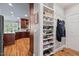 Organized mudroom with shoe shelves, coat hooks, and easy access to the kitchen for efficient home management at 108 Hotelling Ct, Chapel Hill, NC 27514