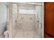 Beautiful bathroom with walk-in shower, rainfall shower head, and luxurious marble tile at 108 Hotelling Ct, Chapel Hill, NC 27514