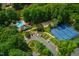 Aerial view of community clubhouse, pool, tennis courts and pond at 110 Glenrose Ln, Cary, NC 27518