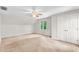 Neutral bedroom with ceiling fan, closet, and window at 110 Glenrose Ln, Cary, NC 27518