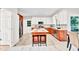 Modern kitchen features white cabinets, a center island with seating, and stainless steel appliances at 110 Glenrose Ln, Cary, NC 27518
