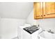 Bright laundry room with newer appliances and storage at 110 Glenrose Ln, Cary, NC 27518