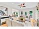 Bright living room boasts hardwood floors, neutral decor, and a view to the dining area at 110 Glenrose Ln, Cary, NC 27518