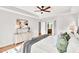 Bright main bedroom suite features tray ceiling, plush rug, king bed and decor at 110 Glenrose Ln, Cary, NC 27518