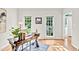 Bright home office boasts hardwood floors, natural light, and built-in shelves at 110 Glenrose Ln, Cary, NC 27518