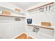 Organized walk-in closet with shelving, rods, and baskets, providing ample storage and organization at 110 Glenrose Ln, Cary, NC 27518