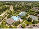 Aerial view of community pool, tennis courts, lake and surrounding neighborhood at 110 Huntersville Rd, Morrisville, NC 27560