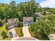 Aerial shot showcasing the homes on a cul-de-sac, complete with lush trees at 110 Huntersville Rd, Morrisville, NC 27560