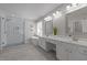 Luxurious bathroom with a glass-enclosed shower, soaking tub, and double vanity with modern fixtures at 110 Huntersville Rd, Morrisville, NC 27560