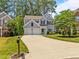 Charming two-story home featuring a spacious driveway, two-car garage, and well-manicured lawn at 110 Huntersville Rd, Morrisville, NC 27560