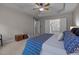 Large main bedroom features a ceiling fan, tray ceiling, and access to a luxurious ensuite bathroom at 110 Huntersville Rd, Morrisville, NC 27560