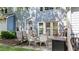 Back patio offering ample seating, with a view of the fenced-in yard and mature trees at 11013 Louson Pl, Raleigh, NC 27614