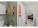 View of the bathroom with neutral tilework, and the bedroom in the background at 11013 Louson Pl, Raleigh, NC 27614