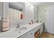 Elegant bathroom featuring double sinks, white cabinetry, and ample counter space at 11013 Louson Pl, Raleigh, NC 27614