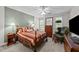 Bedroom featuring a wooden bed, neutral walls, a ceiling fan and natural light at 11013 Louson Pl, Raleigh, NC 27614