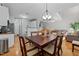 Inviting dining room with wood floors, a chandelier and an adjacent living room at 11013 Louson Pl, Raleigh, NC 27614