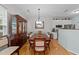 Elegant dining room featuring hardwood floors, a chandelier, and ample seating at 11013 Louson Pl, Raleigh, NC 27614