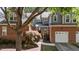 The brick and siding exterior is complemented by a well-maintained yard, offering great curb appeal at 11013 Louson Pl, Raleigh, NC 27614