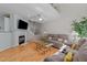 Cozy living room with hardwood floors, a fireplace, and comfortable seating area at 11013 Louson Pl, Raleigh, NC 27614