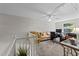 Upstairs loft area perfect for a home office, featuring a couch and natural light at 11013 Louson Pl, Raleigh, NC 27614