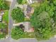 Bird's eye view features a well-maintained home with mature trees, a patio, and an extended driveway at 1102 Laurens Way, Knightdale, NC 27545
