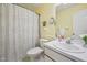 Traditional bathroom boasts a white vanity, a framed mirror and tub with shower at 1102 Laurens Way, Knightdale, NC 27545
