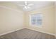 Cozy bedroom with plush carpet, vaulted ceiling, neutral walls and a window at 1102 Laurens Way, Knightdale, NC 27545