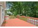 Home deck featuring red painted floorboards, white painted fence, and a backyard view at 1102 Laurens Way, Knightdale, NC 27545