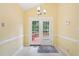 Eat-in kitchen dining area features white trim, tile floors and outdoor access at 1102 Laurens Way, Knightdale, NC 27545