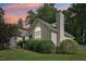 A charming exterior view showcases a well-maintained home with lush landscaping and a welcoming facade at 1102 Laurens Way, Knightdale, NC 27545