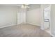 Large main bedroom with ensuite bathroom, plush carpeting and neutral walls at 1102 Laurens Way, Knightdale, NC 27545