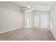 Spacious main bedroom with vaulted ceiling, ceiling fan and neutral carpet at 1102 Laurens Way, Knightdale, NC 27545