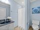 Blue bathroom featuring granite countertop, toilet, and a shower and tub combo at 111 Finsbury Street St, Durham, NC 27703