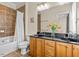 Bathroom with dual sinks, tiled shower and bath at 111 Finsbury Street St, Durham, NC 27703
