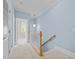 Upstairs hallway with neutral carpet and soft blue walls at 111 Finsbury Street St, Durham, NC 27703