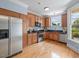 Well-equipped kitchen with stainless steel appliances, wood cabinets, and granite countertops at 111 Finsbury Street St, Durham, NC 27703