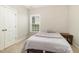 Cozy bedroom featuring soft carpet, natural light through the window and closet space at 111 Laporte Path, Garner, NC 27529