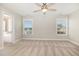 Inviting bedroom with a ceiling fan and two windows offering lots of natural light at 111 Laporte Path, Garner, NC 27529