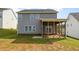 Rear exterior of a home with gray siding and a screened porch at 111 Laporte Path, Garner, NC 27529