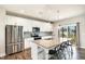 Stylish kitchen featuring stainless steel appliances, granite counters, and ample cabinet space at 111 Laporte Path, Garner, NC 27529