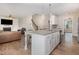 Open kitchen featuring granite countertops, an island with seating, and stainless steel appliances at 111 Laporte Path, Garner, NC 27529
