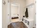 Welcoming mudroom with built-in bench and coat hooks, leading to a cozy bedroom at 111 Laporte Path, Garner, NC 27529