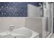 Bathroom featuring a shower, a tub, and tiled walls at 1113 Smokewood Dr, Apex, NC 27502