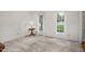 Neutral bedroom with carpet, wainscoting, and natural light from the two windows at 1113 Smokewood Dr, Apex, NC 27502