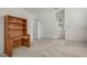Upstairs bedroom with carpet, built-in bookshelf desk and window at 1113 Smokewood Dr, Apex, NC 27502