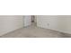 Hallway features plush carpeting and leads to a doorway with a staircase in the background at 1113 Smokewood Dr, Apex, NC 27502