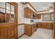 Functional kitchen with wood cabinets, white countertops, and essential appliances included at 1113 Smokewood Dr, Apex, NC 27502