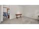 Spacious room with carpet, wainscoting, table and view of living room at 1113 Smokewood Dr, Apex, NC 27502
