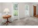 Bright room with carpet and natural light from the two windows at 1113 Smokewood Dr, Apex, NC 27502