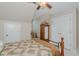 Bedroom featuring a ceiling fan, ample closet space, and neutral carpeting at 114 Fieldstone Dr, Burlington, NC 27215
